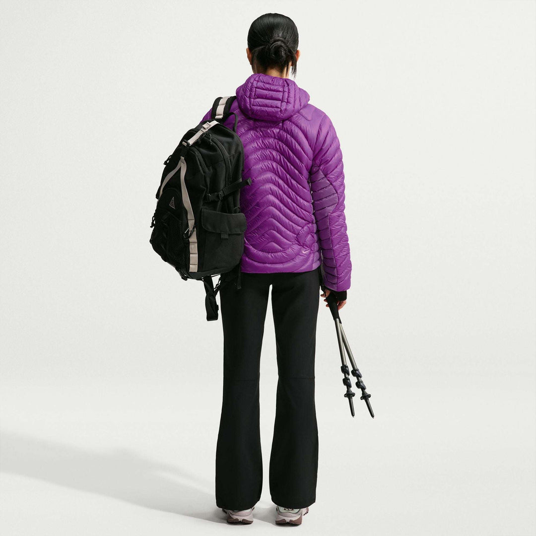 ACG Lava Flow Ultralight down jacket in vivid purple nylon, with chevron quilting, a hood and lightweight puffer design.