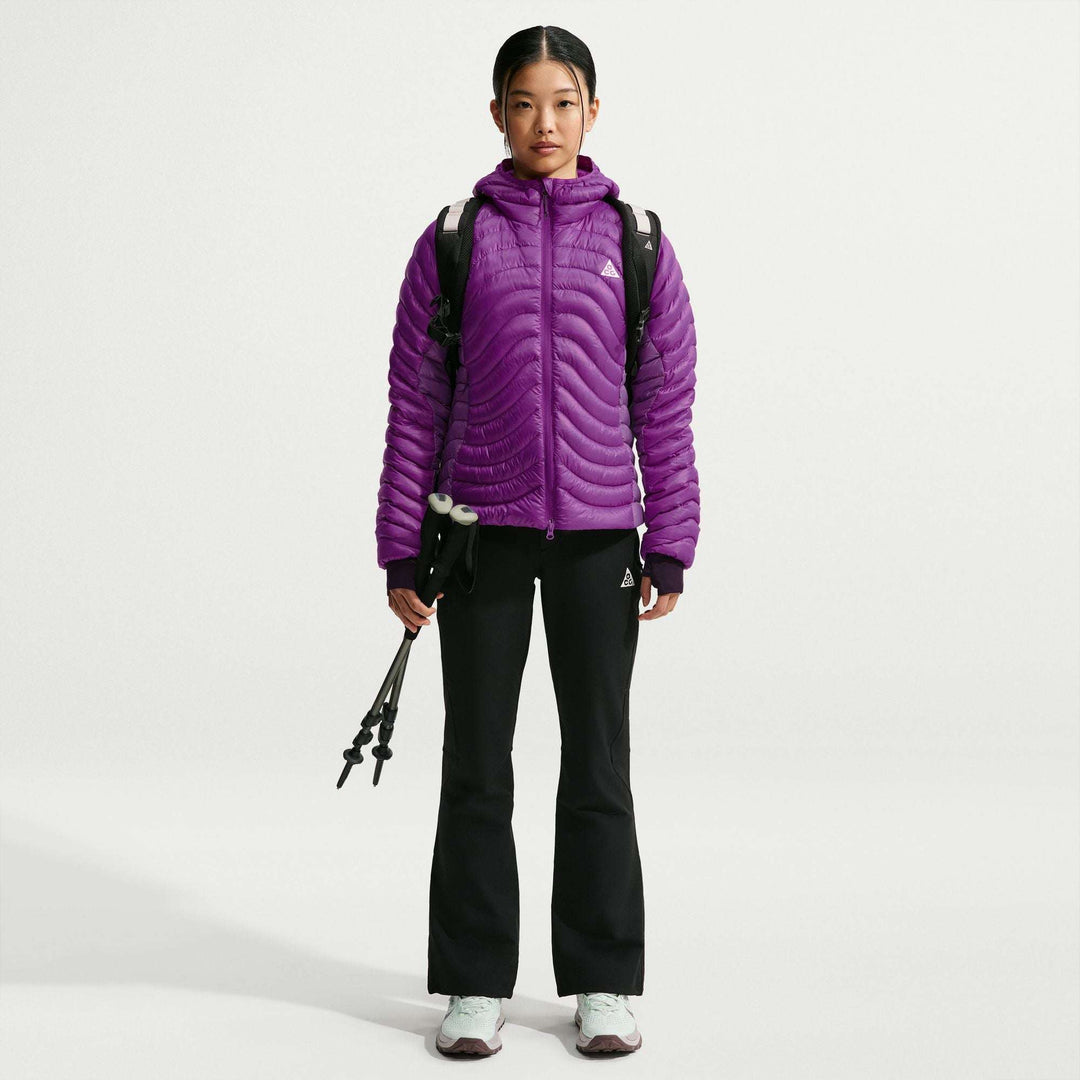 ACG Lava Flow Ultralight women's down jacket in bright purple nylon with horizontal quilting, hood, full zip and bungee hem.
