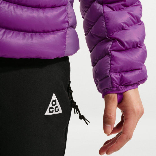 ACG Lava Flow Ultralight down jacket in vivid purple nylon with glossy quilted baffles, shown with black ACG pants.