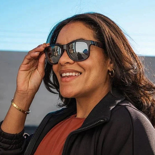 Woman wearing sunglasses with a blurred background