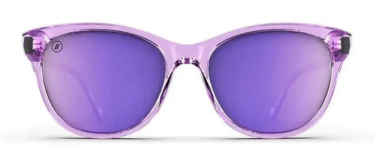 Blenders Palmy Lilac Lush cat-eye sunglasses with a translucent crystal-lavender frame and purple mirrored lenses.