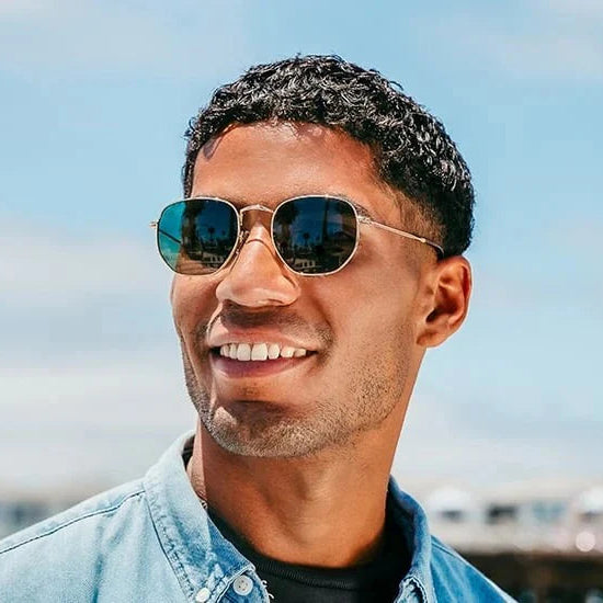 Man wearing sunglasses with a blurred background