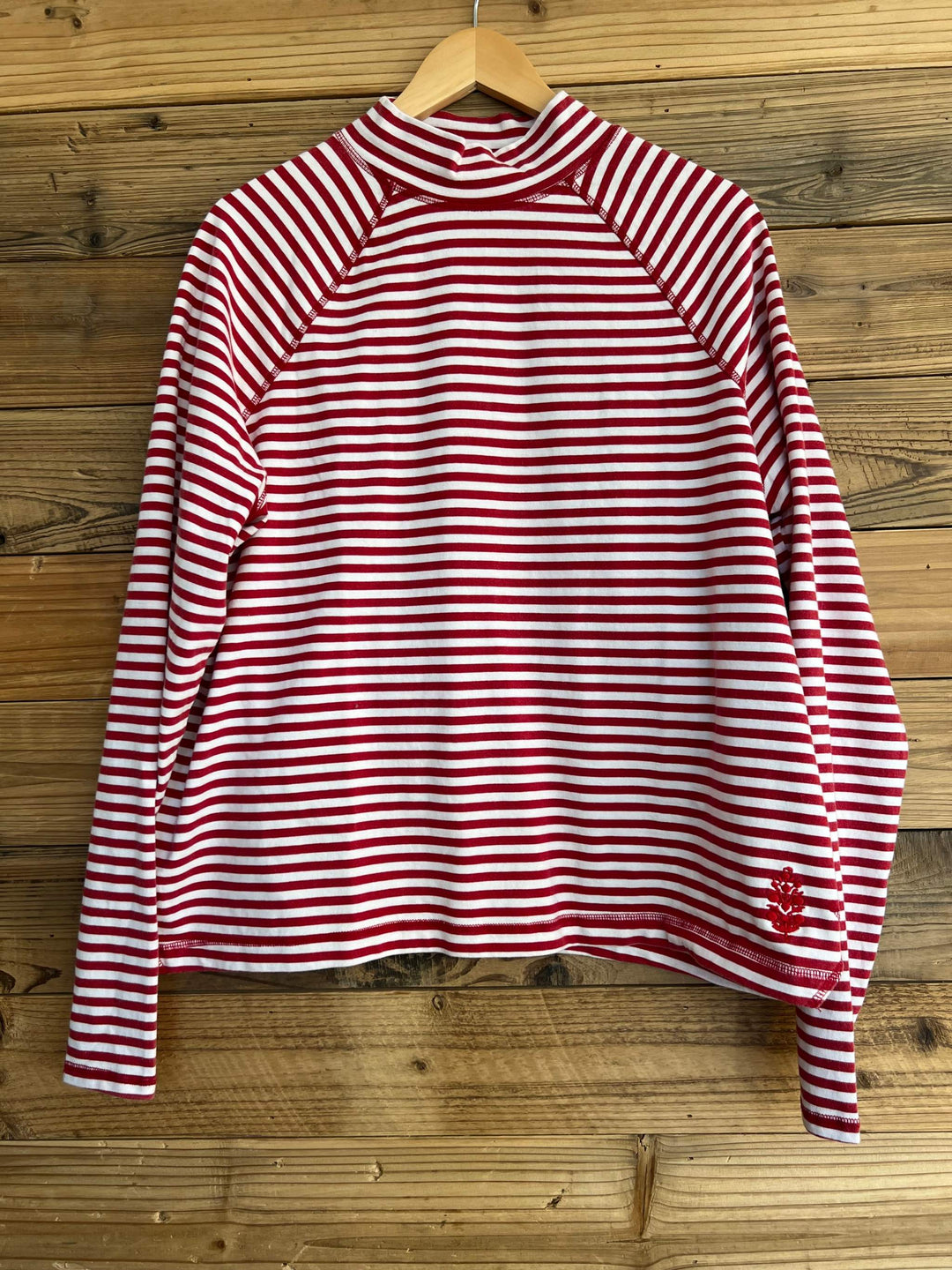 FP Movement Restoration striped cotton pullover in red and white, with a mock neck, raglan sleeves, and logo detail.