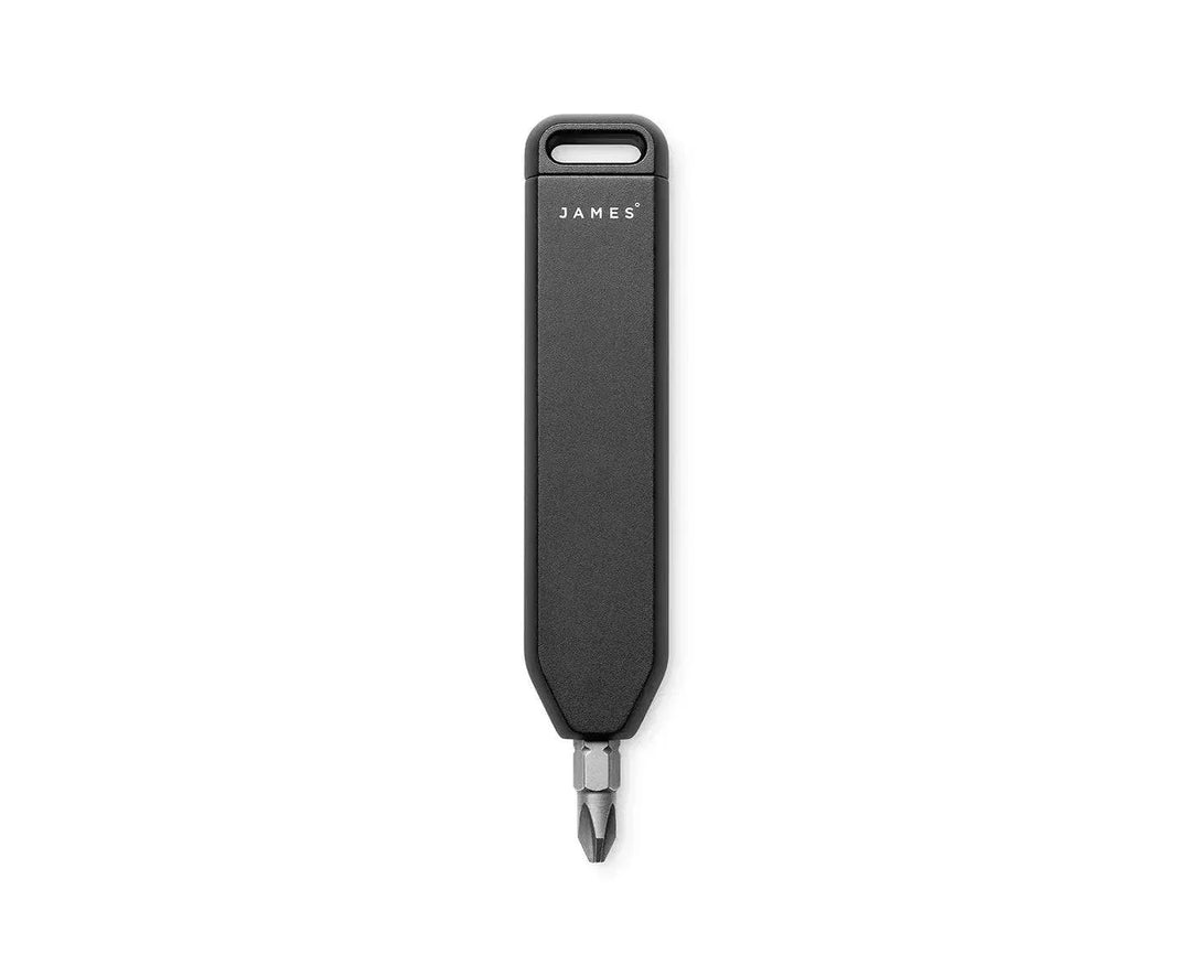 James Brand black bit driver with a slim matte handle, subtle logo, and exposed metal screwdriver bit at the tip.