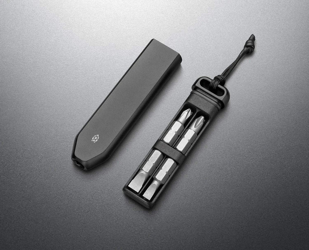 James Brand bit driver with black matte handle, four silver screwdriver bits, and a black cord loop for carrying.