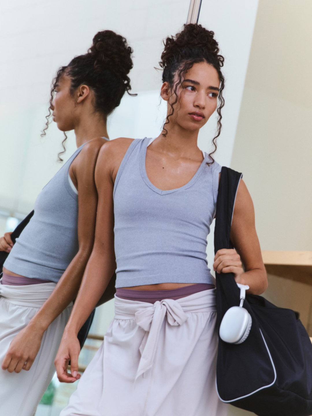 Ultra-light, breathable fabrication; equipped with UPF 40 protection; buttery-soft hand feel; sleeveless silhouette; ribbed detailing; v-neckline; racerback.