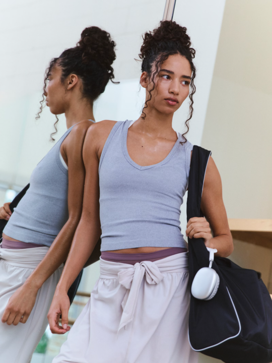 Ultra-light, breathable fabrication; equipped with UPF 40 protection; buttery-soft hand feel; sleeveless silhouette; ribbed detailing; v-neckline; racerback.